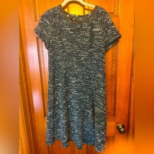 Talbots green tweed dress is knee length with black faux leather accents